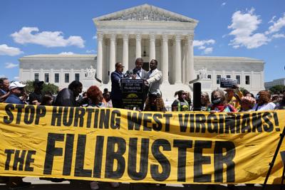 Activists rally in support of voting rights in front of the Supreme Court in Washington