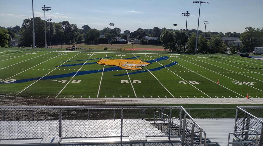 Football field with logo, claw marks