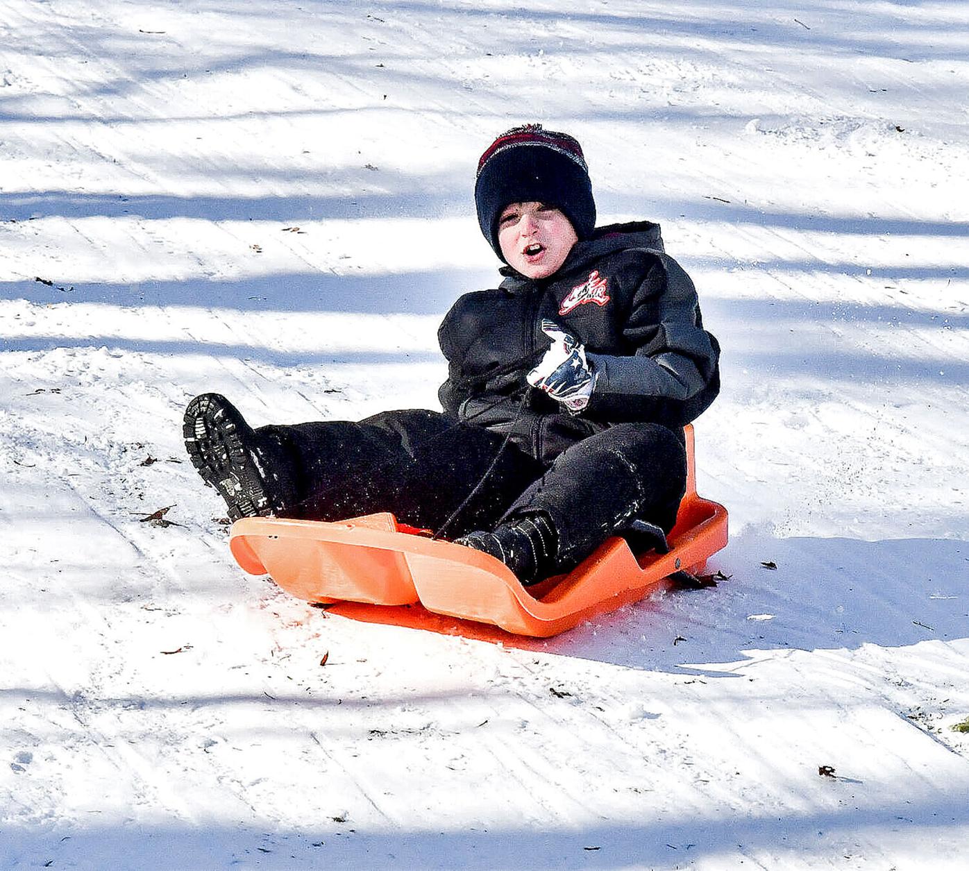 Alexavier Kolixcz sleds down the hill