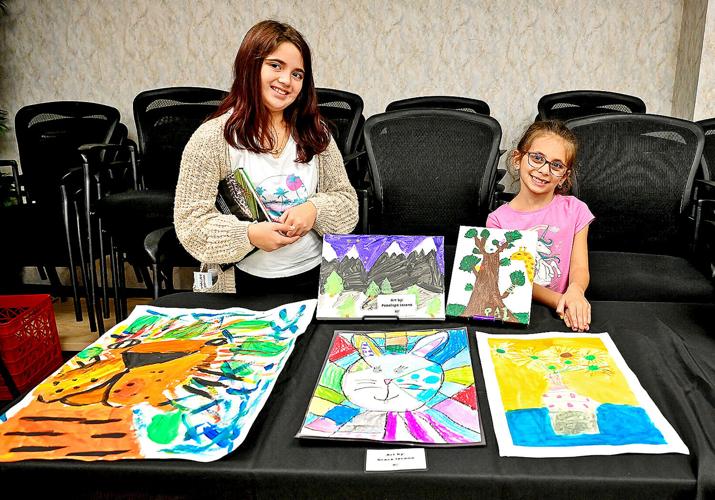 Cousins show off their artwork