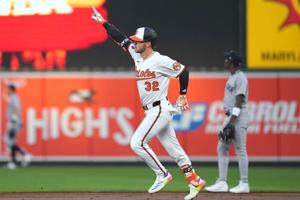 Orioles build early four-run lead, hold off Yankees