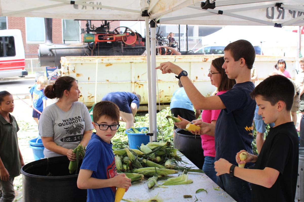 sweet corn fest shucking corn