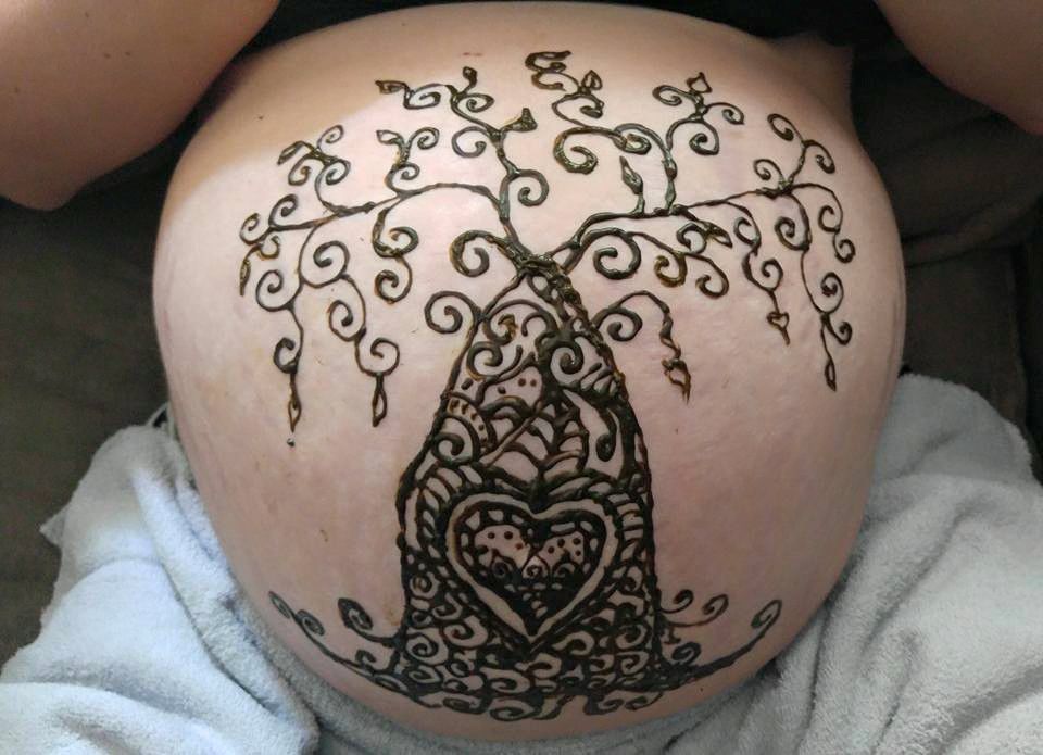 Henna Tattoo on a Womans Pregnant Belly and Hands 994054 Stock Photo at  Vecteezy