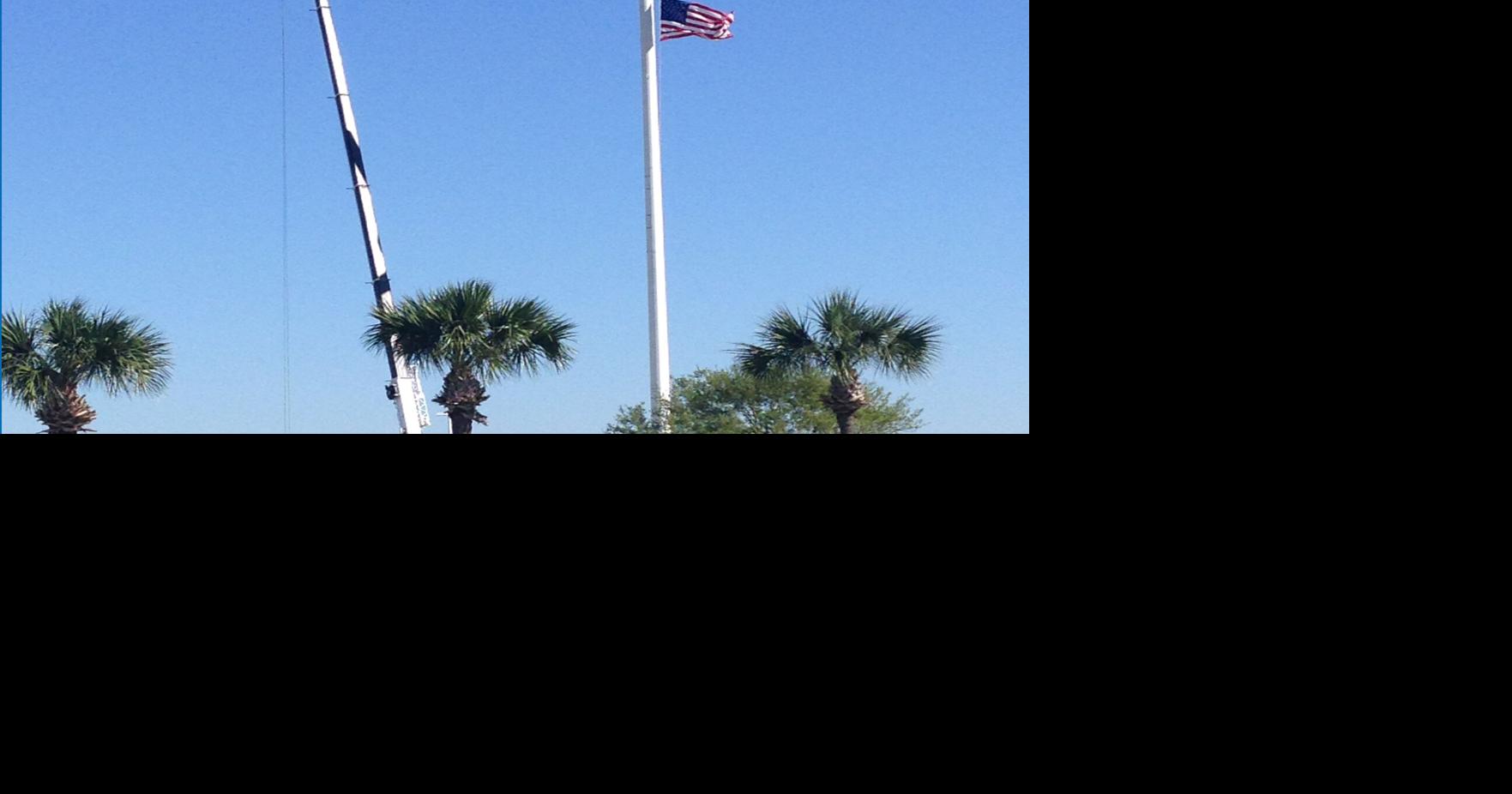 Giant flagpole boasts day job as well Community