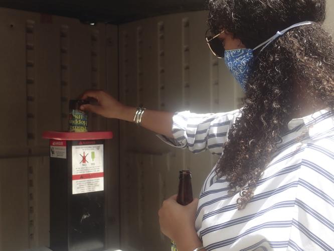 UVI Scientist Crushing Glass Waste with Recycling Project