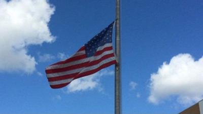 Flags flying at half-staff today (Monday) to honor a fallen firefighter