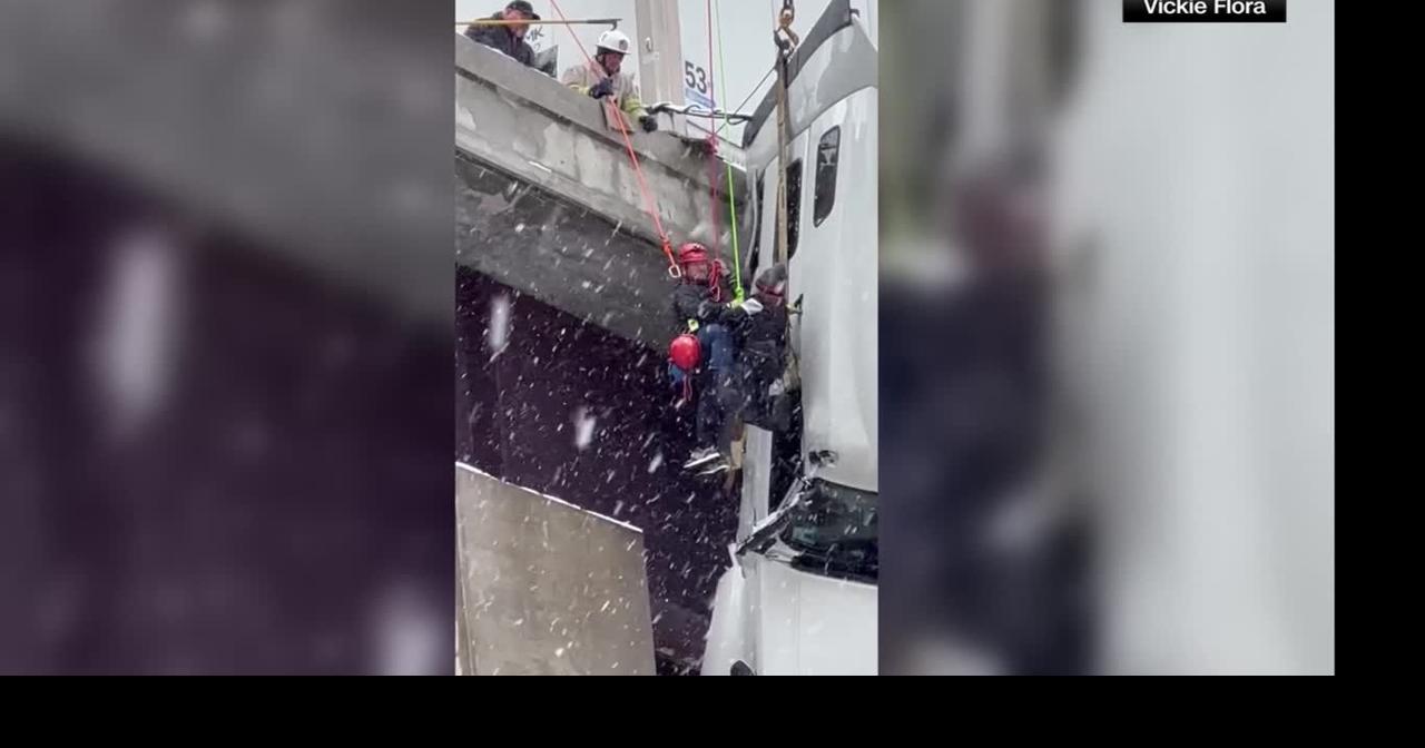Emergency crews rescue tractor-trailer driver dangling off West Virginia bridge