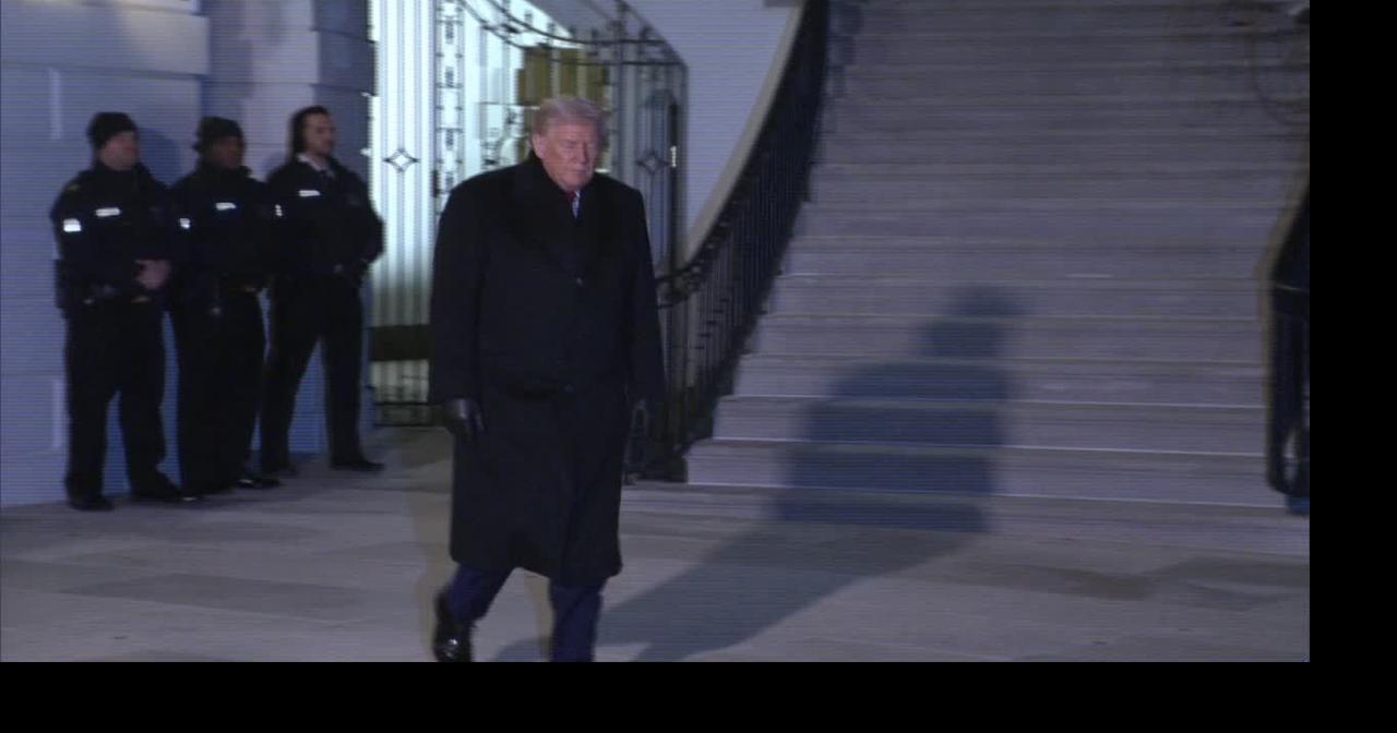 Donald Trump talks to reporters before departing for Switzerland