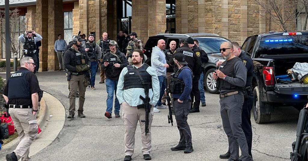 Armed man rammed vehicle into Michigan synagogue and was fatally shot by security