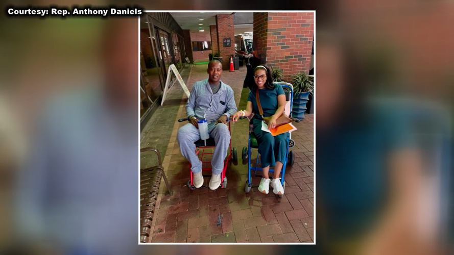 Anthony Daniels and his wife leaving the hospital