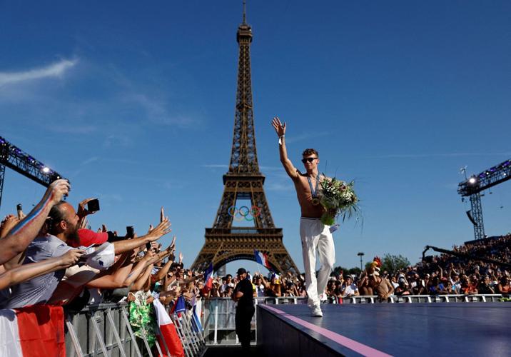 Paris mayor plans to keep Olympic rings on the Eiffel Tower. But not everyone is happy
