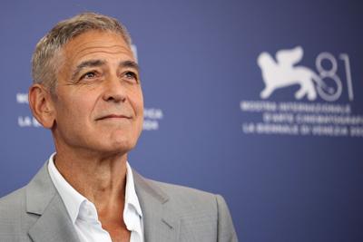 George Clooney is farming and driving a tractor. Seriously
