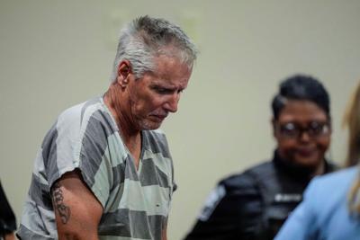 Father of alleged Georgia school shooter pleads not guilty to charges that he shares responsibility for killings