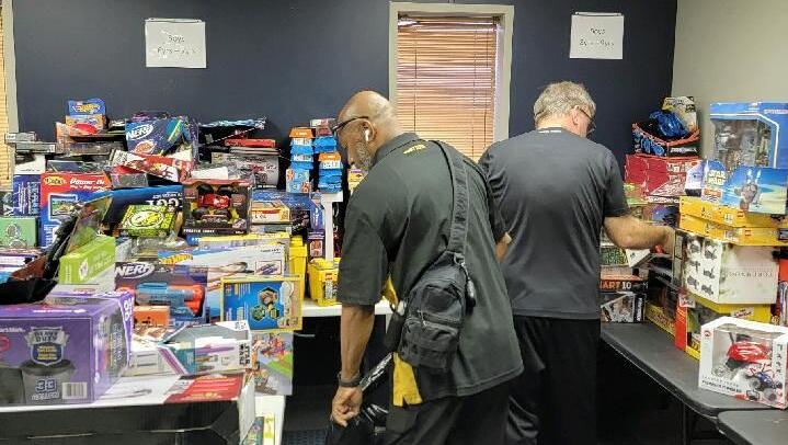 Volunteers pack gifts for Toys for Tots