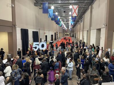 Attendees wait to be let in ahead of the 50th anniversary celebration of Girls Inc.