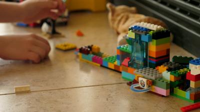 Child playing with Lego bricks