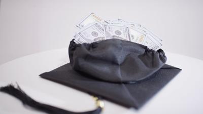 CAP AND GOWN WITH LOADS OF CASH