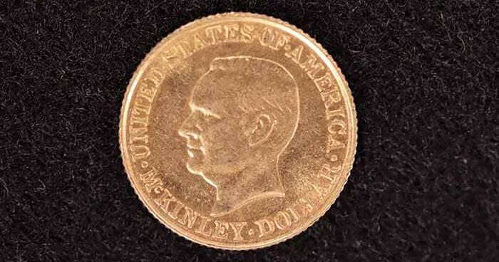 Unclaimed property like baseball cards and gemstones on display