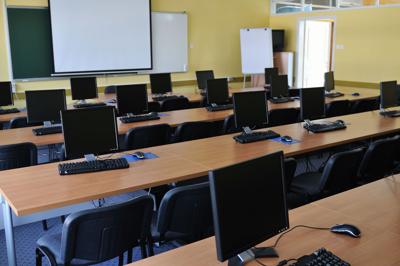 School classroom with smart board and computers