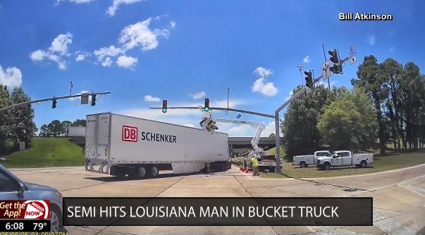 Semi hits man in bucket truck