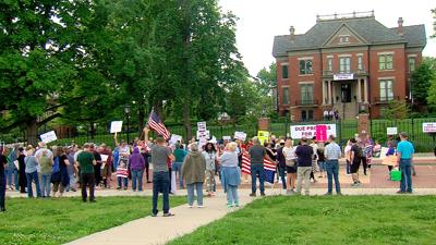 Protestors gather outside governor's mansion.jpg