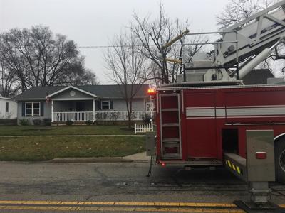 Neighbor called hero after saving woman from fire