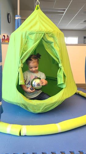 Child playing in swing