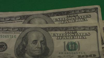 dollars-american-money-close-up-on-a-green-background-hromakey-SBI-351123324.jpg