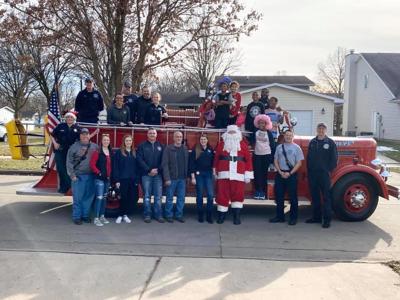 Champaign PD and Fire Department give back to victims of home fire
