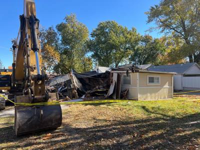 Police investigating after person uses excavator to knock down half a house in Petersburg