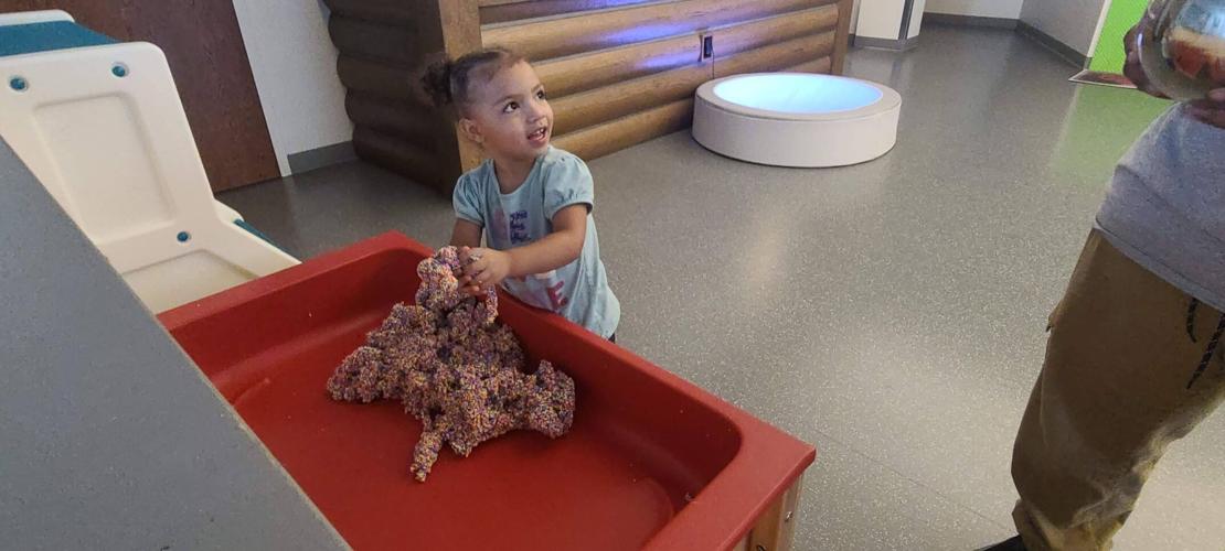 Child playing with sensory toy