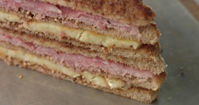 cooking-a-rustic-brie-and-ham-sandwich-with-mustard-sauce-in-an-industrial-style-kitch-SBI-350569180.jpg