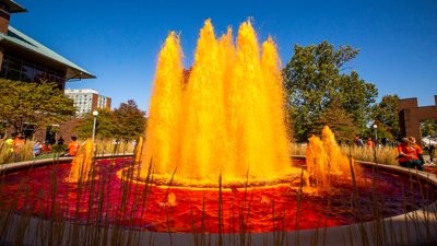 Alumni Center Fountain dyed orange for Homecoming