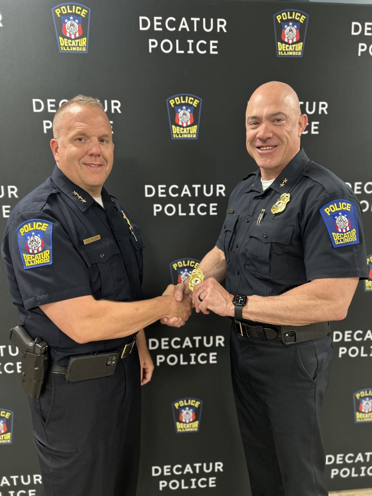 DPD Chief Brad Allen presents deputy chief badge to Erik Ethell.