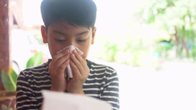 little-asian-child-sick-with-flu-sneezing-and-clean-with-tissue-paper-SBI-351311260.jpg