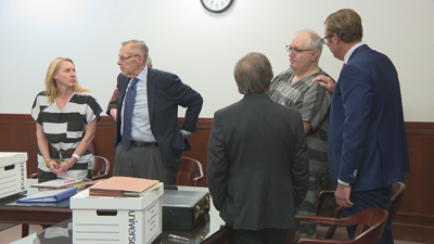 Cadigan and Finley in court still.png