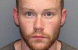 Man charged with stealing electronics on display