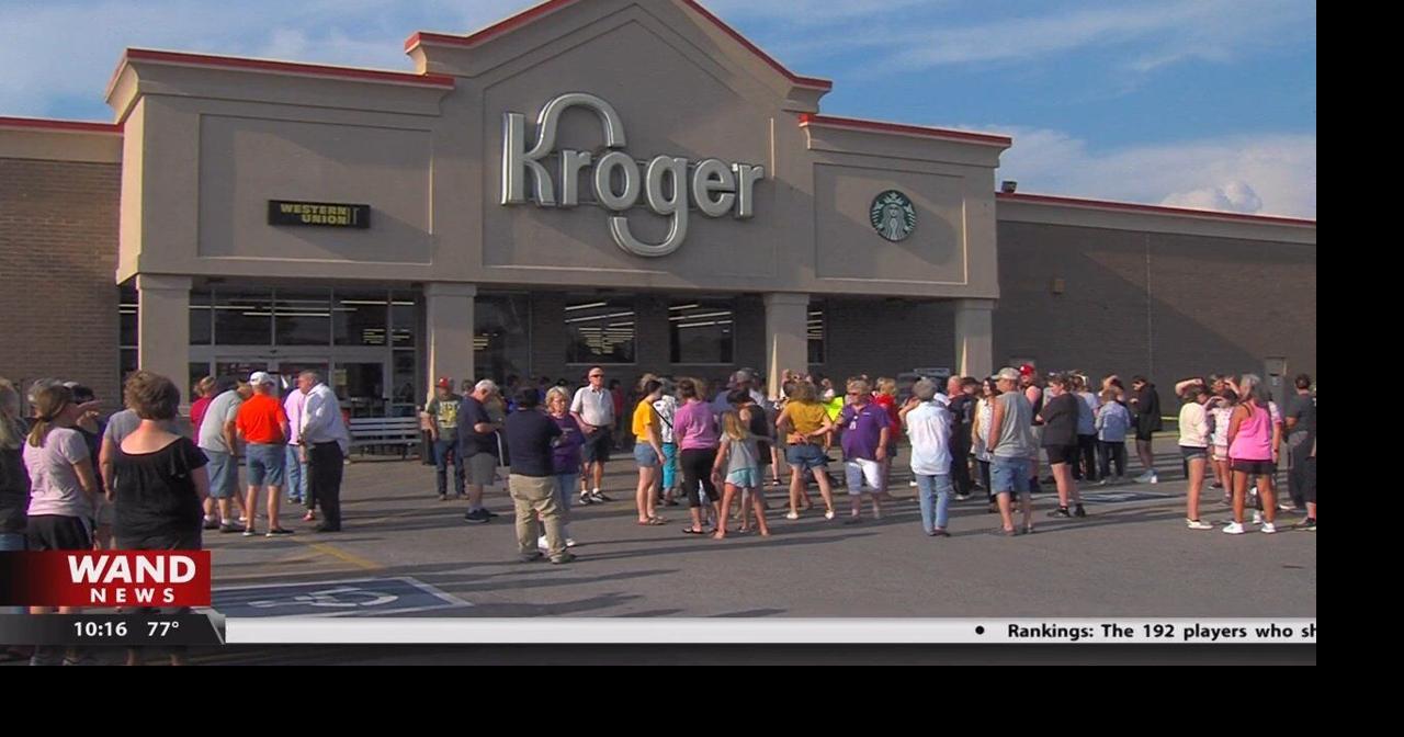 Community members hold a rally to reopen Taylorville Kroger Top