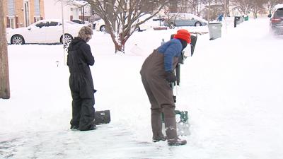 MF Football Players shovel driveways and sidewalks.jpg