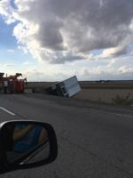 Troopers: Wind caused semi-truck to roll over on overpass