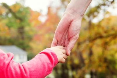 Toddler hand holding