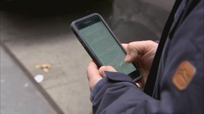 Scrolling on cell mobile phone (generic).jpg