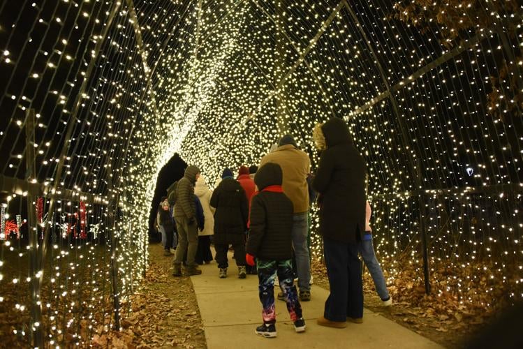 People strolling through the arch at Holiday GLOW