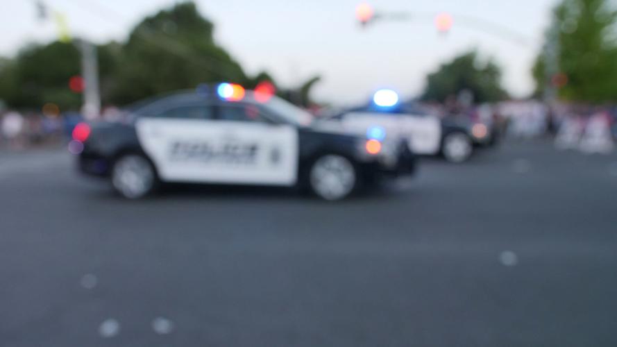 Police cruiser, emergency lights, blurred