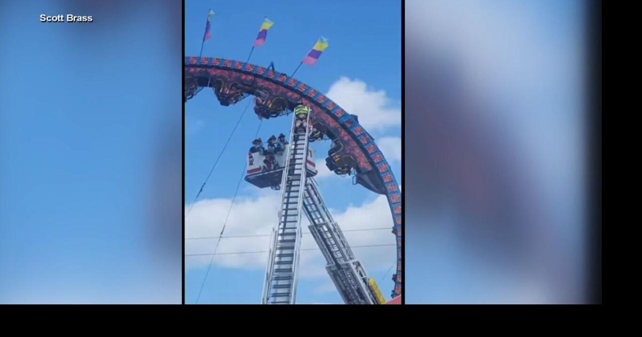 several people stuck upside down on fair ride Video