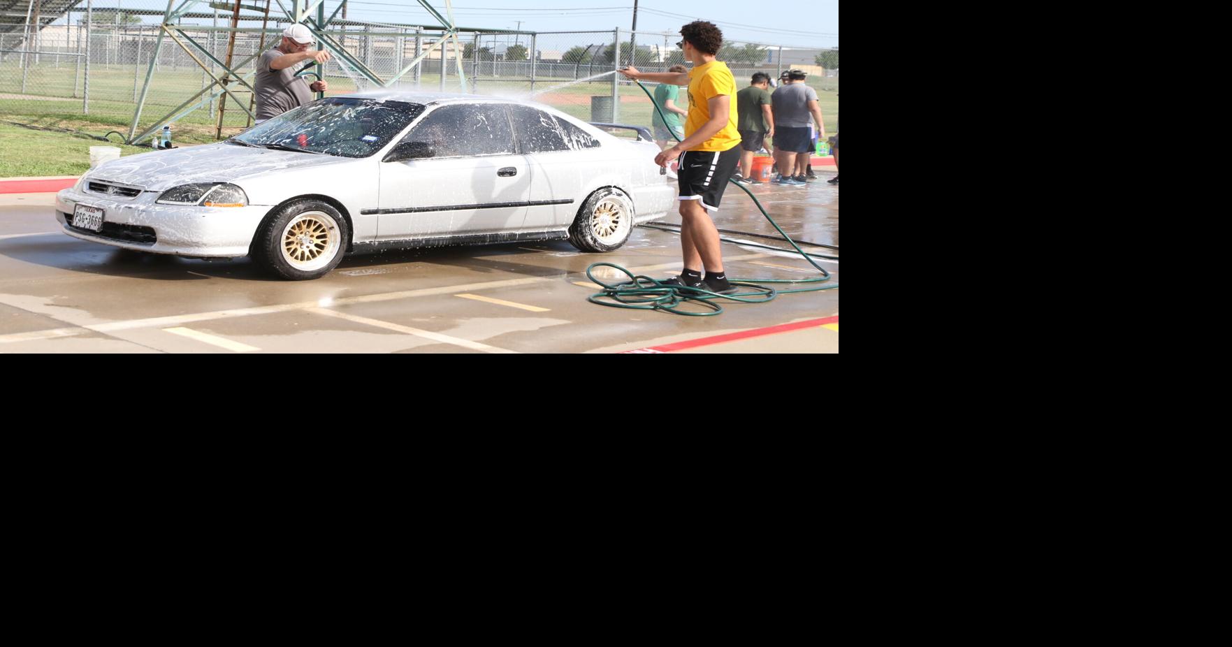 WHS band car wash, parking lot sale held Education