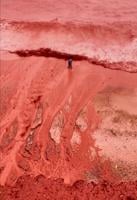 Rain creates a crimson spectacle on Iran's Hormuz Island for the first time this year