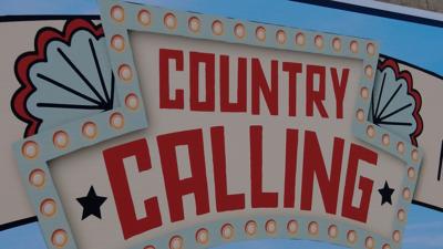 Sign reading "COUNTRY CALLING" in orange letters 