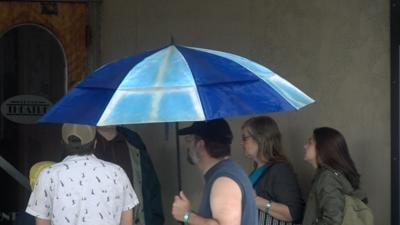 Man Carrying Umbrella