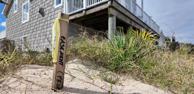 Easement post along a beachfront property on Bowers Beach.